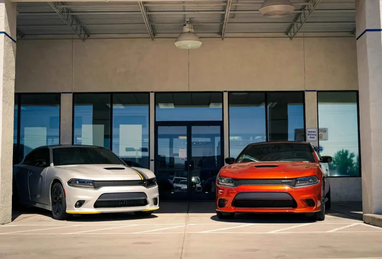 2 cars in the front of the building